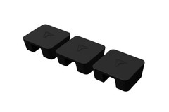 Three black rectangular rubber pads or caps positioned in a row on a white background, each with a raised surface featuring a simple triangular design. The pads have an indented cutout on one end.