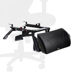A black ergonomic footrest mechanism attached to the frame of an office chair. The design includes adjustable components and a padded leg support, enhancing comfort for seated users. The chair's silhouette is visible in the background.
