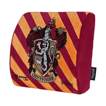 Plush cushion featuring the Gryffindor house crest from Harry Potter. The crest displays a lion with a banner reading "Gryffindor" against a maroon and gold striped background. The cushion also has the labels "Secretlab" and "Harry Potter" on the side.