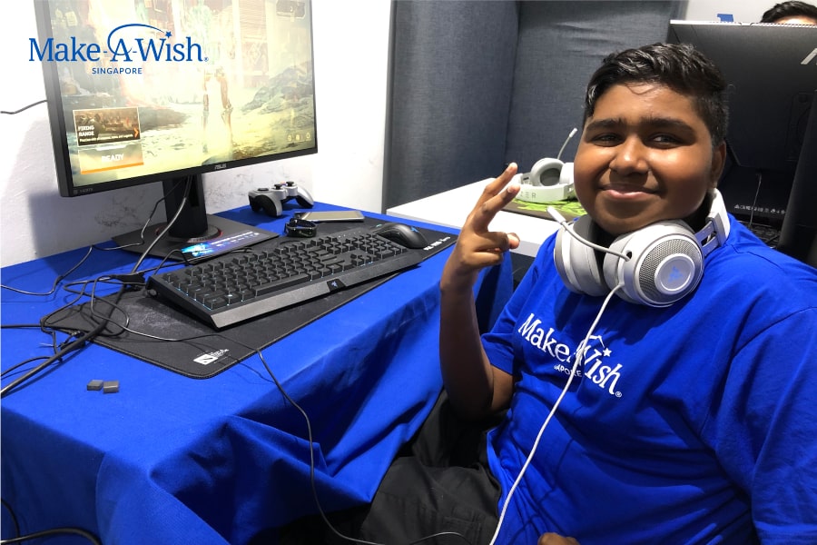 A Singapore wish child playing computer game