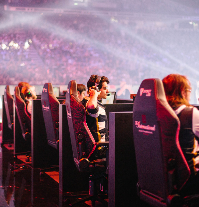 Team secret esports team sitting on Secretlab TITAN Evo gaming chairs at The International DOTA2 esports tournament