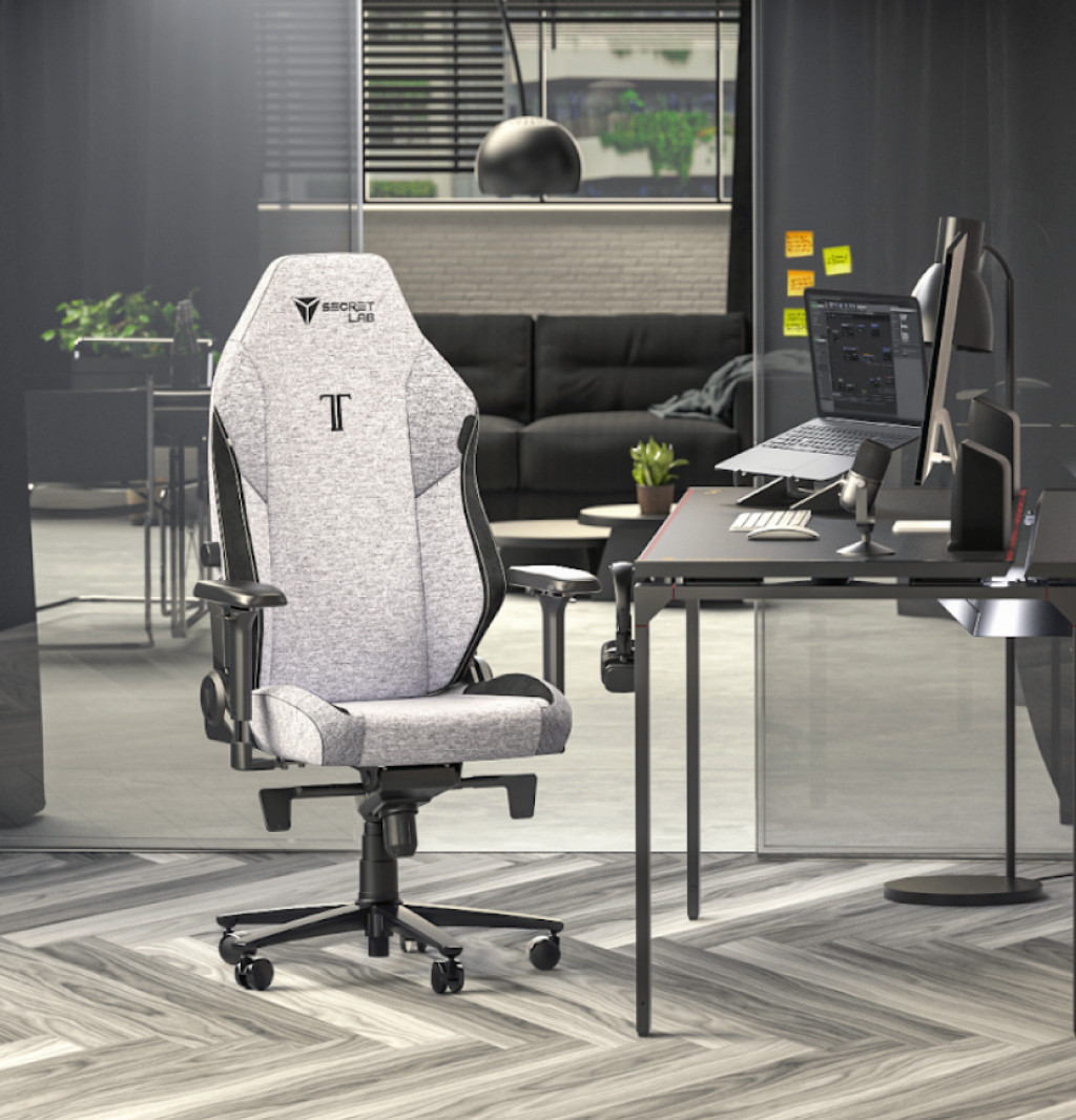 A grey cookies and cream Secretlab TITAN Evo gaming chair and set up in a work-from-home environment