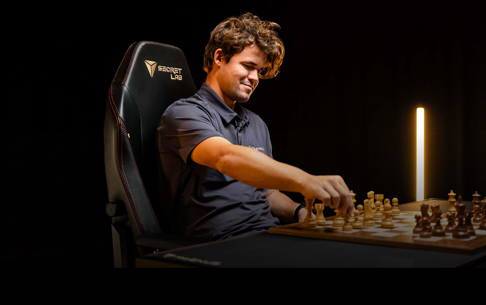 Magnus Carlsen playing chess on a Secretlab TITAN Evo chair